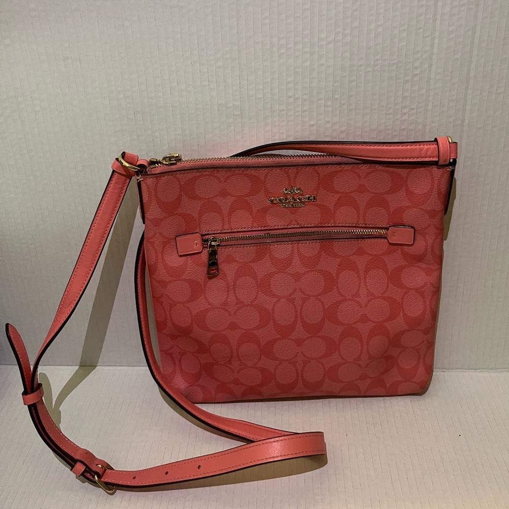 Coach Pink Crossbody Bag with Adjustable Strap and Textured Finish